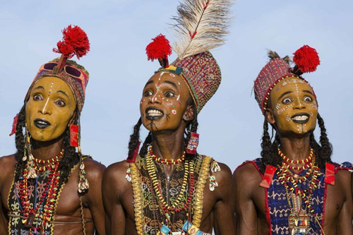 Wodaabe men perform the "Yaake" ritual dance as part of the Gerewol, a week-long courtship ceremony in Chad. It must be one of the only African cultures which allows girls to take the lead in choosing their betrothed and even married women have the right to take a different man as a sexual partner. 